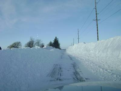 Roadway through a large snow drift